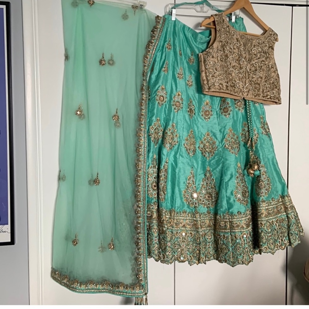 Beautiful hand stitched beaded lehenga with can can skirt